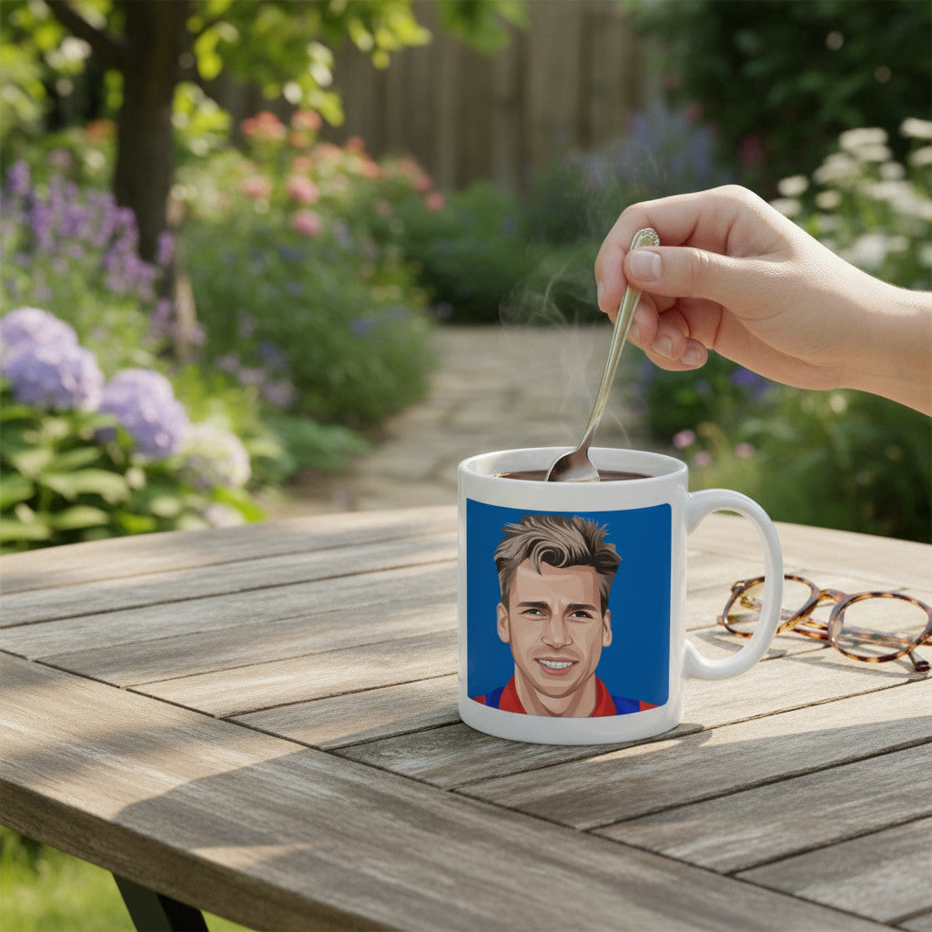 Retrotext ceramic mug featuring an illustration of Alan Pardew on a wooden table in a garden setting.