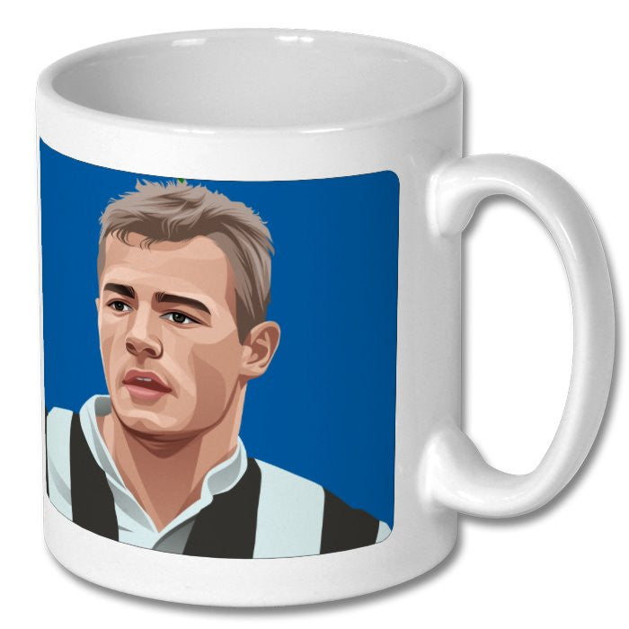 Retrotext ceramic mug featuring a graphic illustration of Alan Shearer in a Newcastle United kit on a blue background