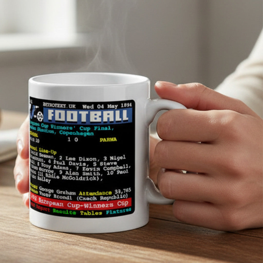Retrotext Arsenal 1994 European Cup-Winners' Cup ceramic mug with teletext design held in hands