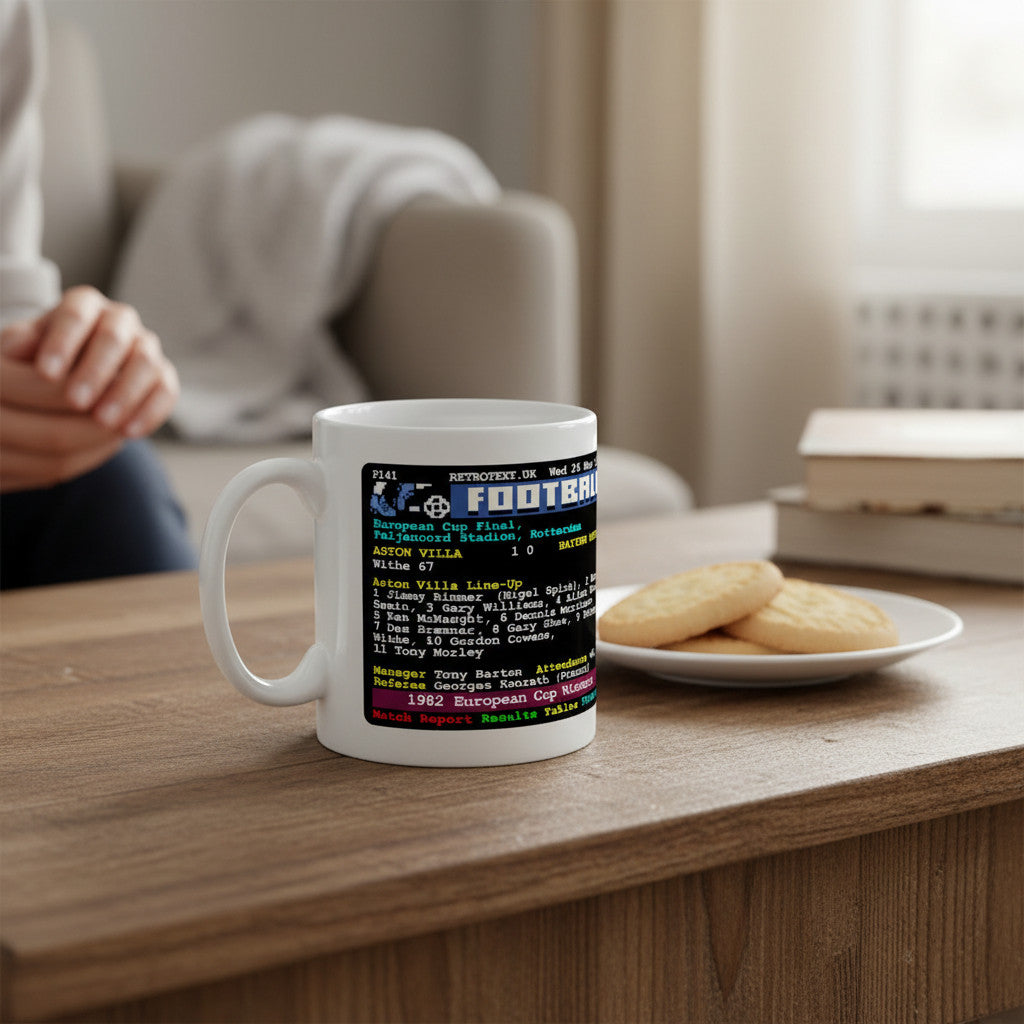 Retrotext Aston Villa 1982 European Cup Winners teletext design mug on a wooden table with a plate of cookies.
