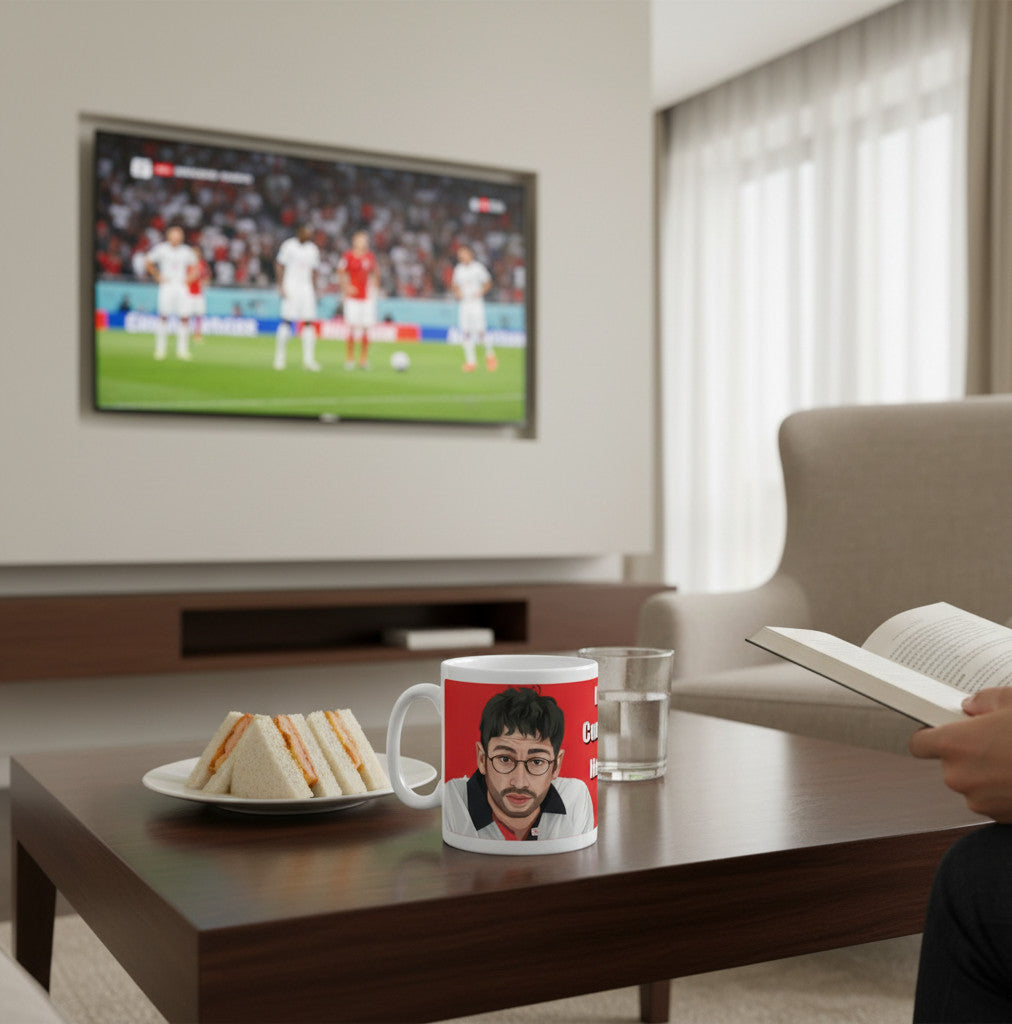 Retrotext 11oz glossy white mug featuring Baddiel and Skinner Euro 96 It's Coming Home design on a coffee table