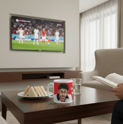 Retrotext 11oz glossy white mug featuring Baddiel and Skinner Euro 96 It's Coming Home design on a coffee table