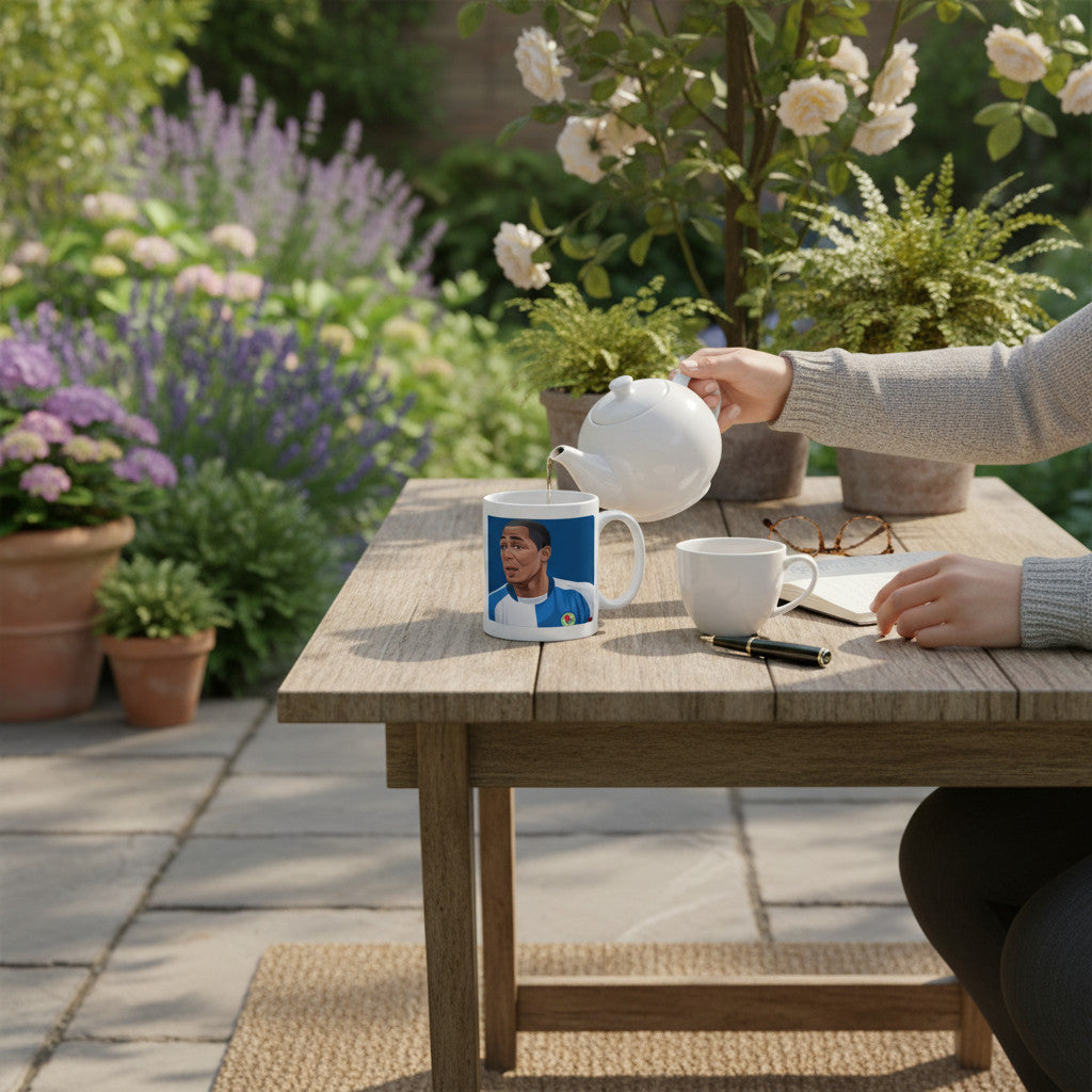 Retrotext Blackburn Rovers 2002 League Cup Winners Andy Cole mug on a wooden garden table with tea being poured