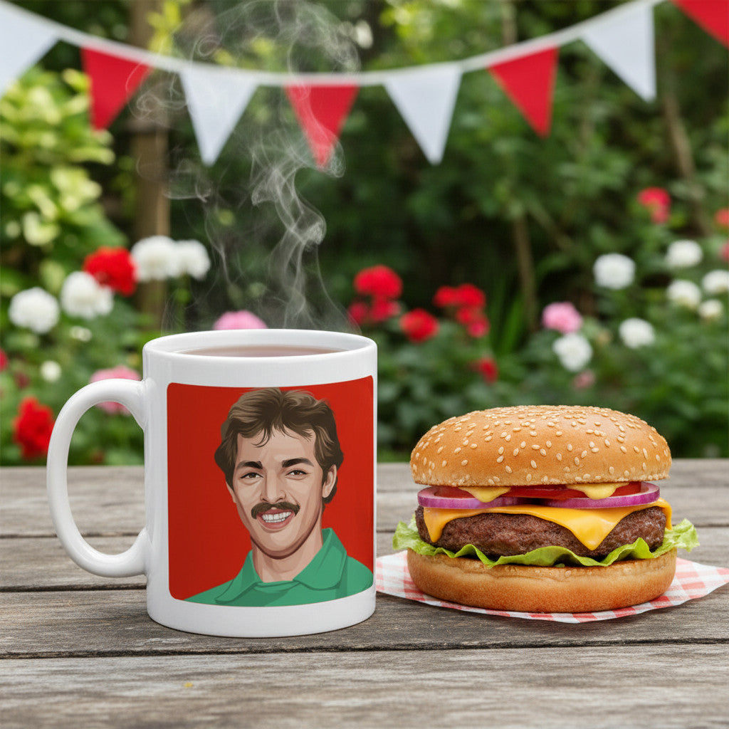 Retrotext 11oz glossy white ceramic mug featuring a Bruce Grobbelaar illustration, set on a wooden table with a burger