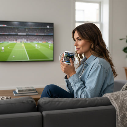 Woman holding a Retrotext Chelsea 1971 European Cup-Winners Cup Final teletext ceramic mug while watching football