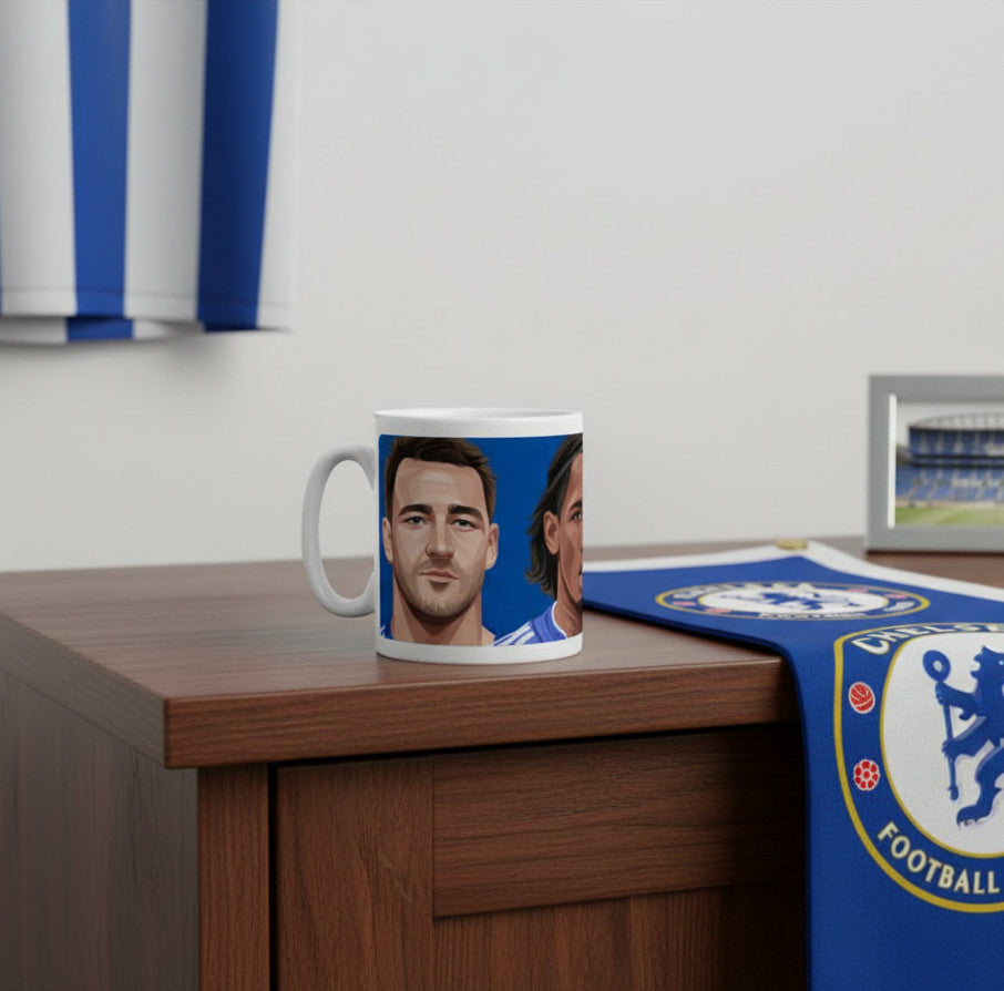 Retrotext Chelsea FC legends ceramic mug featuring illustrations of John Terry and Didier Drogba on a wooden desk.