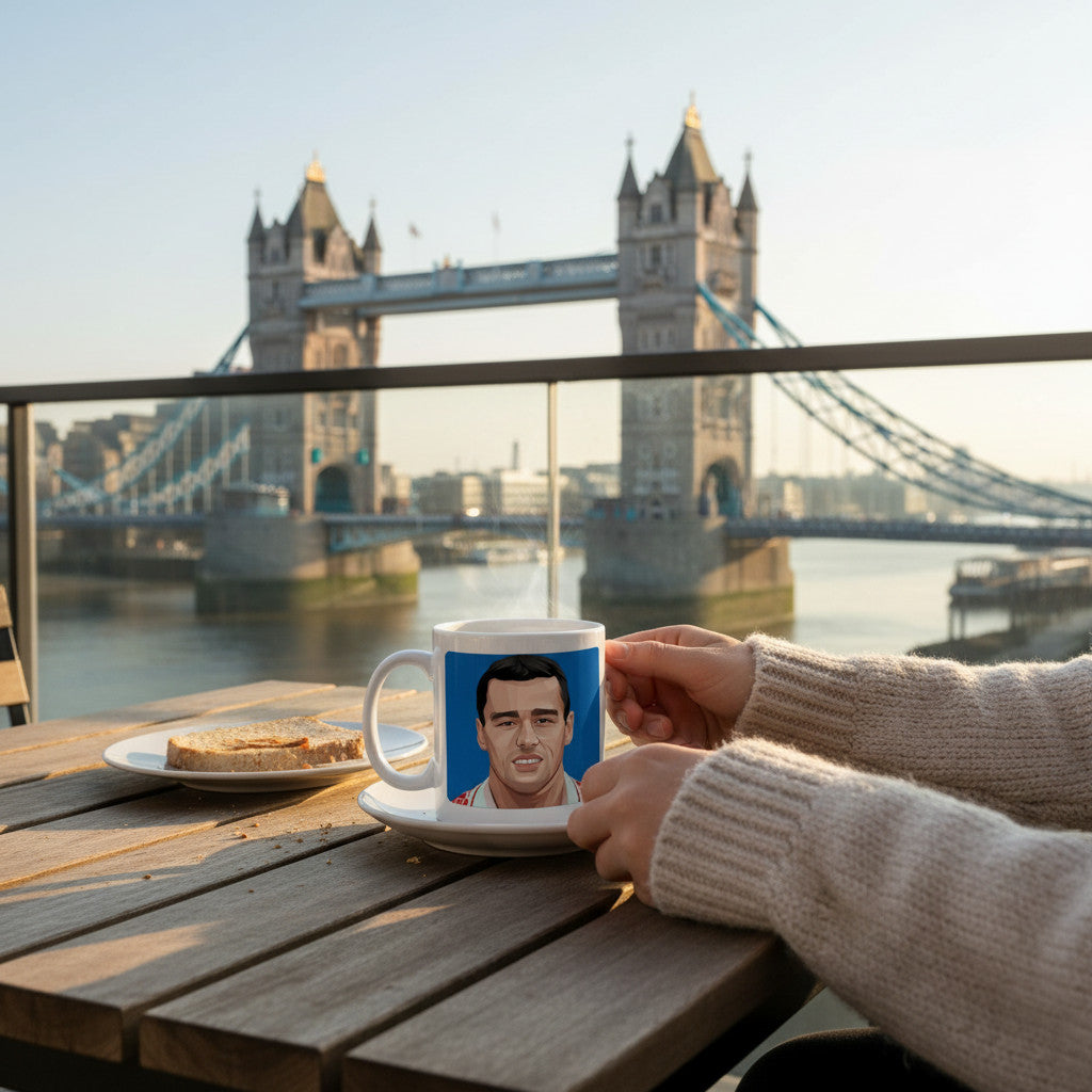 Retrotext Charlton Athletic 1998 Clive Mendonca mug held on a balcony overlooking Tower Bridge at sunrise