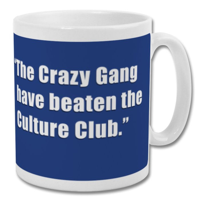 Retrotext white 11oz ceramic mug featuring the John Motson Crazy Gang quote on a blue background