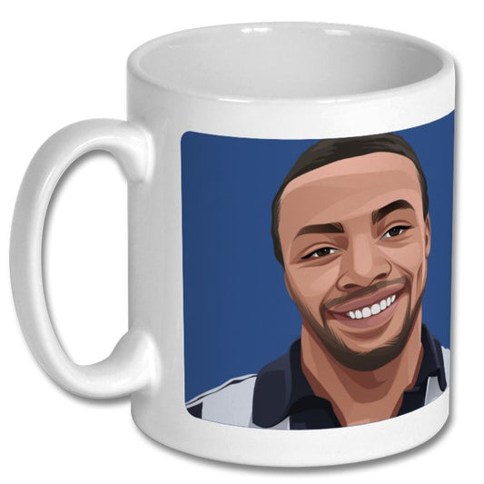 Retrotext ceramic mug featuring a vibrant illustrated portrait of football legend Cyrille Regis on a blue background