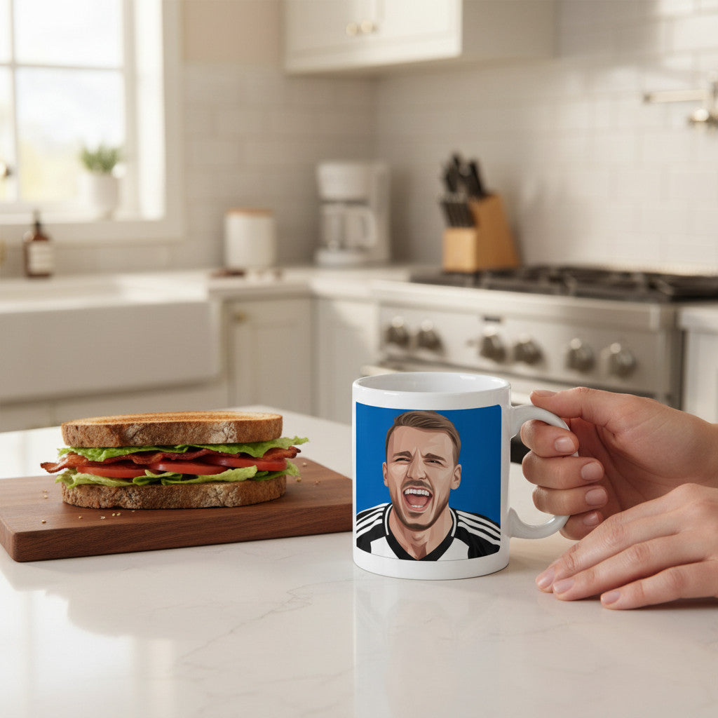 Retrotext Newcastle United 2025 League Cup Winners Dan Burn ceramic mug held in a hand on a kitchen counter