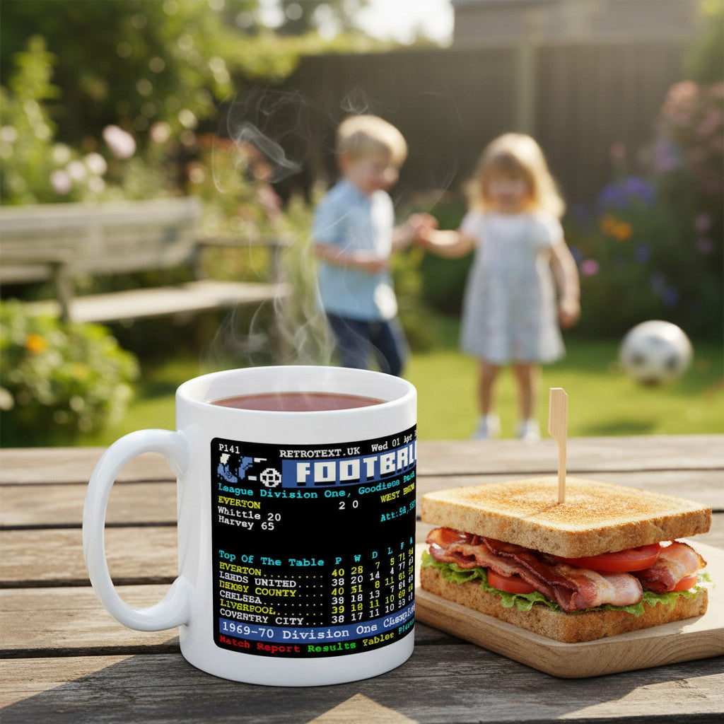 Retrotext Everton 1970 Champions ceramic mug with teletext league table graphic on a garden table with a sandwich.