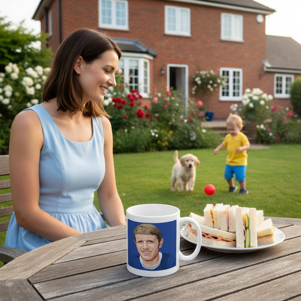 Retrotext Everton 1966 FA Cup Brian Labone mug on a garden table with a woman, child, and puppy in the background.