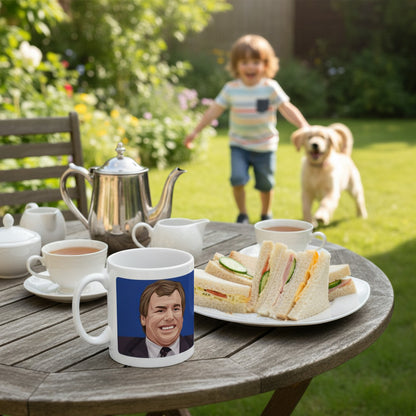 Retrotext white ceramic mug featuring Joe Royle on a garden table with tea and sandwiches in the background.