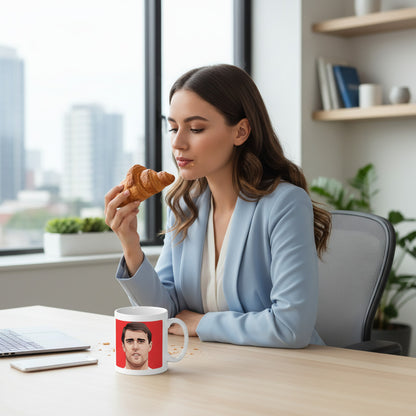 Retrotext white 11oz mug featuring Geoff Hurst 1966 World Cup graphic on a desk with a woman eating a croissant