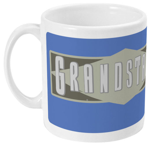 Retrotext 11oz glossy white ceramic mug featuring a blue and grey Grandstand sports show wraparound design.