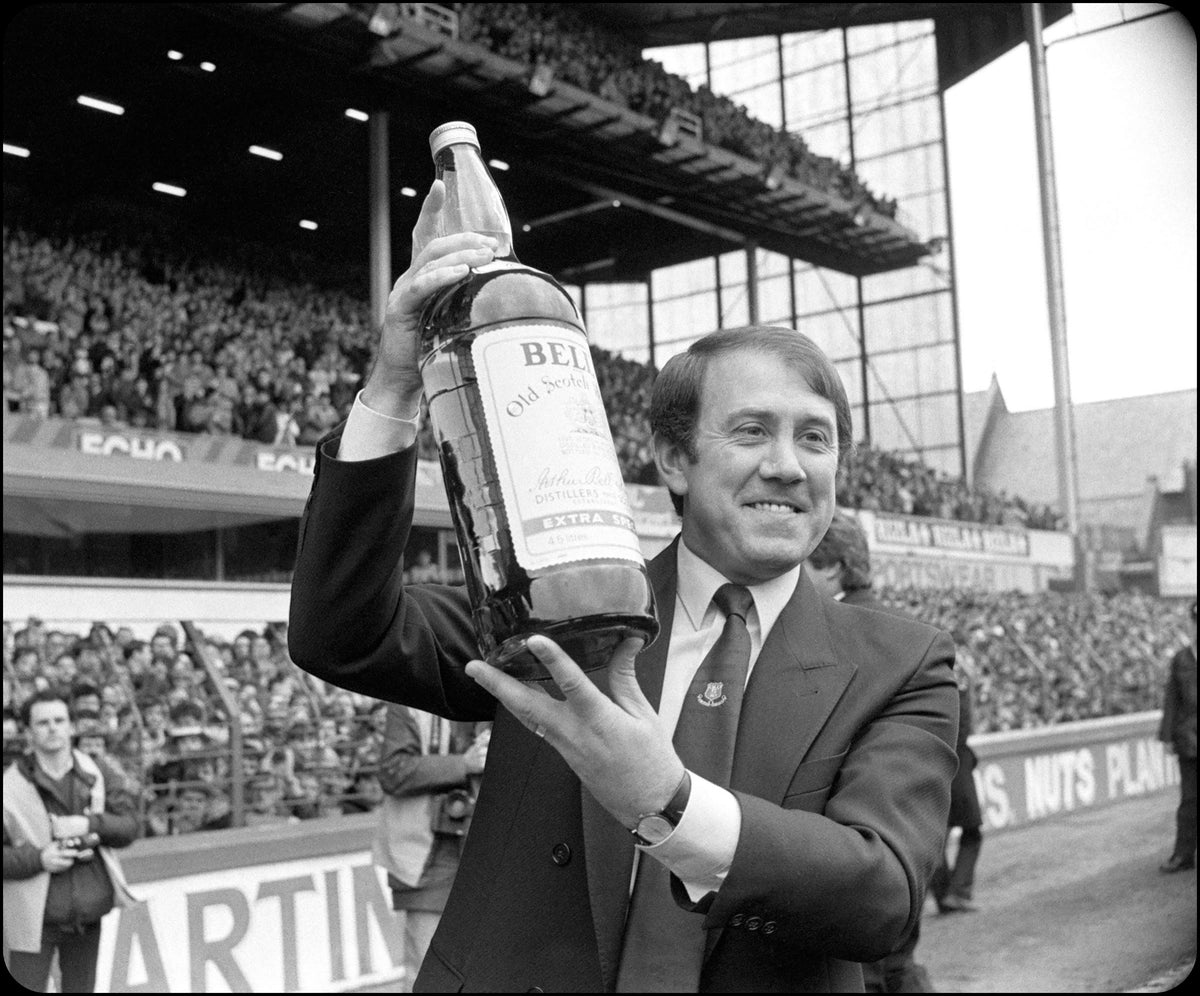 Retrotext The 80s Team book features Howard Kendall holding a large bottle of Bell's whisky at Goodison Park stadium.
