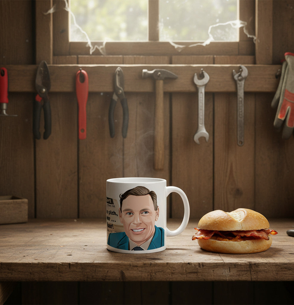 Retrotext 11oz glossy white mug featuring a Kenneth Wolstenholme illustration on a rustic wooden workshop workbench.