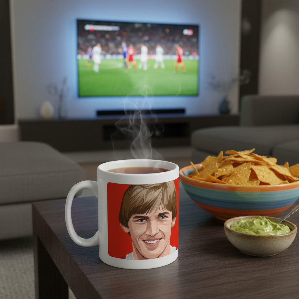 Retrotext ceramic mug featuring a portrait of Kenny Dalglish on a coffee table with a bowl of chips and guacamole.