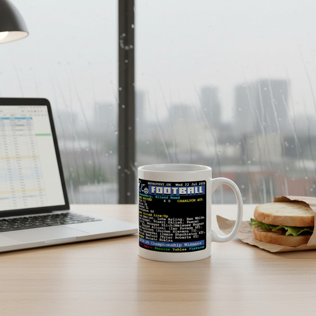 Retrotext Leeds United 2020 Championship Winners ceramic mug with retro teletext football graphic on a wooden desk.