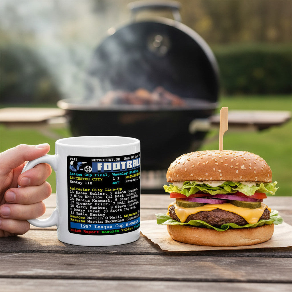 Retrotext Leicester City 1997 League Cup Winners ceramic mug featuring teletext match stats held outdoors by a grill.