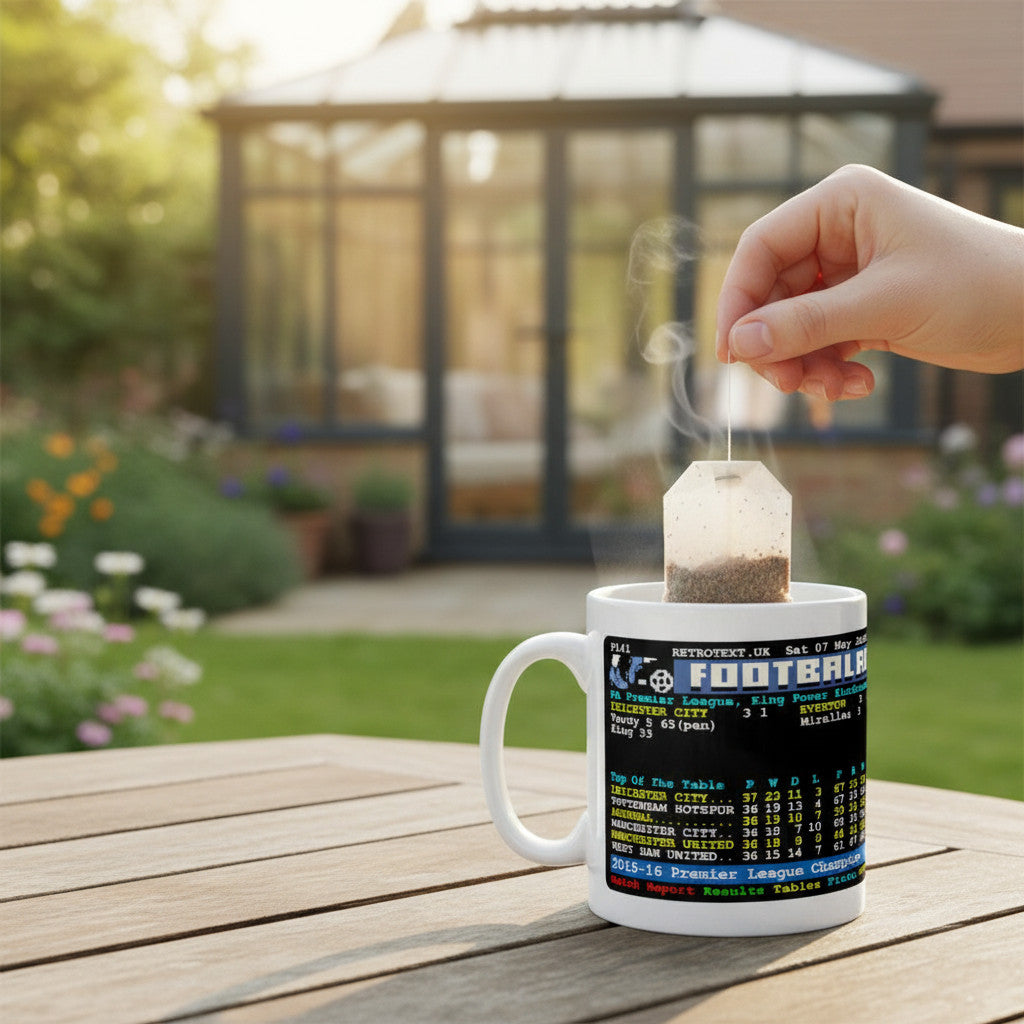 Retrotext Leicester City 2016 Premier League Champions mug with teletext design on a wooden table in a garden