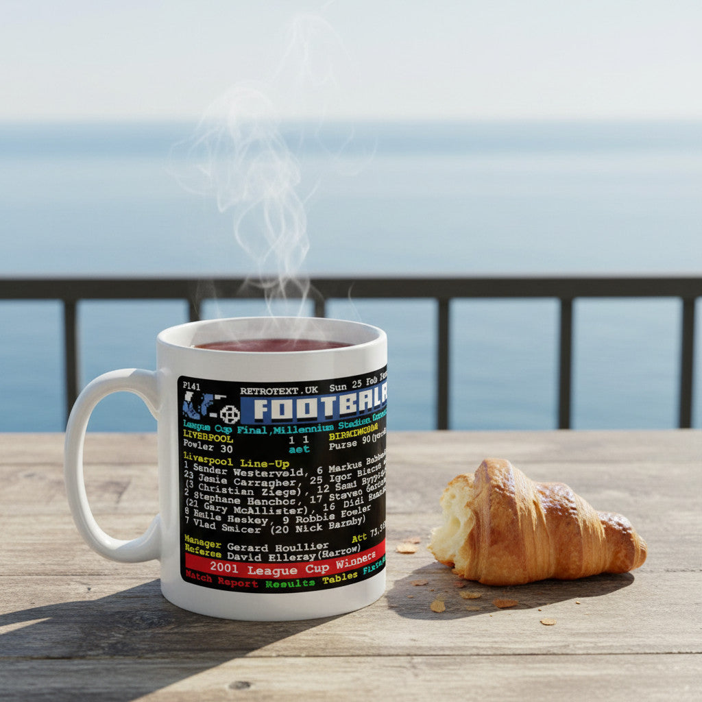 Retrotext Liverpool 2001 League Cup Winners ceramic mug with teletext design on a wooden table by the sea