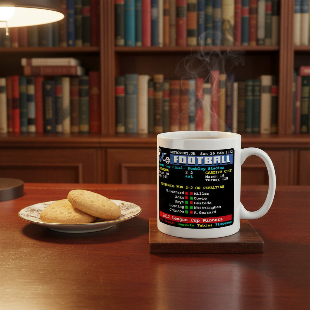 Retrotext Liverpool 2012 League Cup Winners white ceramic mug with teletext football score design on a wooden desk