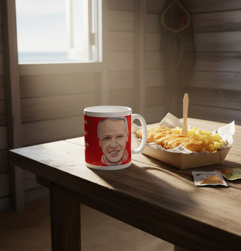 Retrotext Liverpool Bill Shankly ceramic mug with red design and quote on a wooden table next to fish and chips.