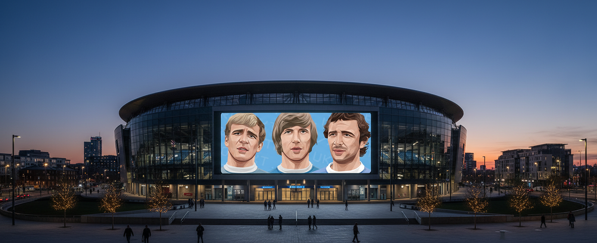Retrotext Manchester City mug featuring legends Bell, Lee, and Summerbee displayed on a stadium screen at sunset