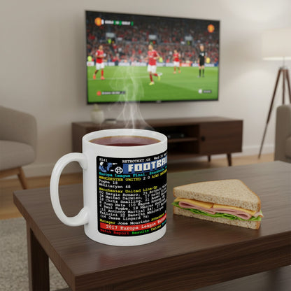 Retrotext Manchester United 2017 Europa League Winners ceramic mug with teletext design on a wooden table with a sandwich