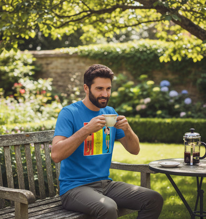 A man wearing a blue Retrotext t-shirt featuring a 1966 Muhammad Ali vs Henry Cooper boxing graphic, sitting outdoors.