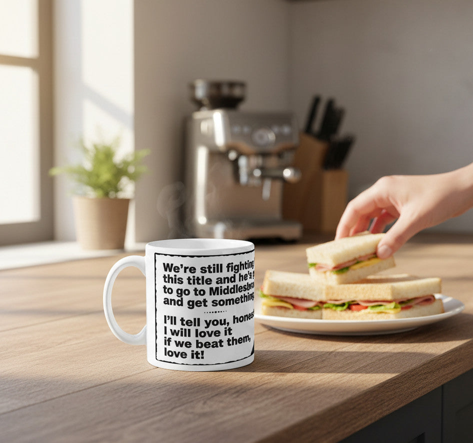 Retrotext Newcastle United 1996 Kevin Keegan I Will Love It quote mug on a kitchen counter with a sandwich
