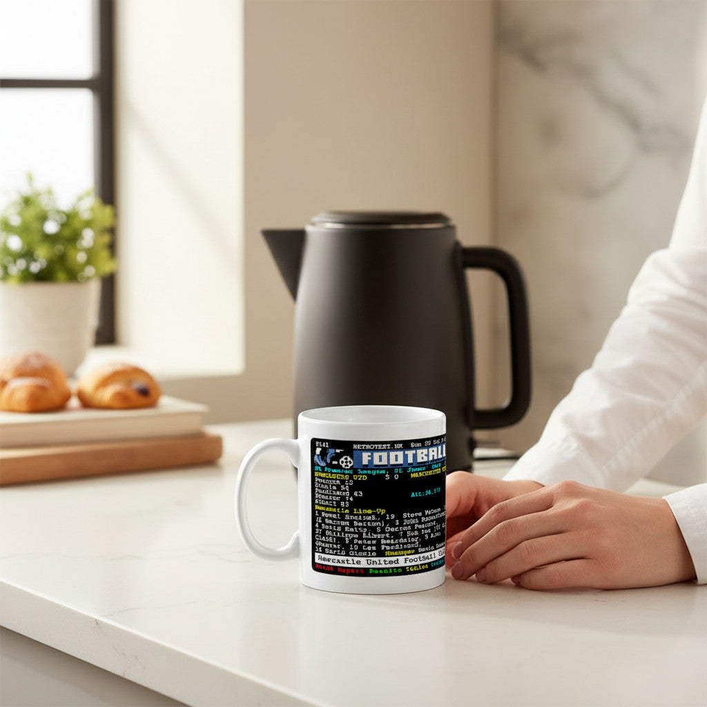Retrotext Newcastle United 1996 teletext ceramic mug featuring Alan Shearer and match stats on a kitchen counter.