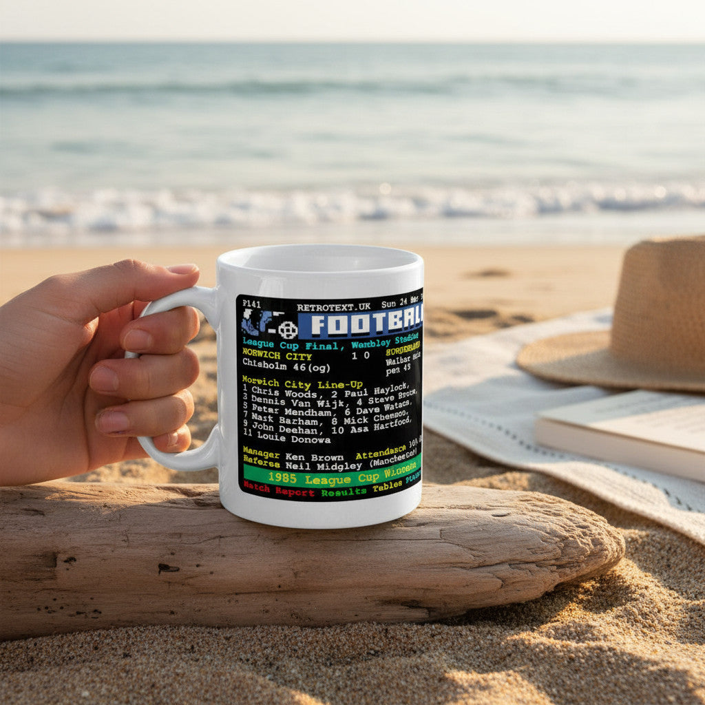 Retrotext Norwich City 1985 League Cup Winners ceramic mug featuring a vintage teletext match report on a beach.