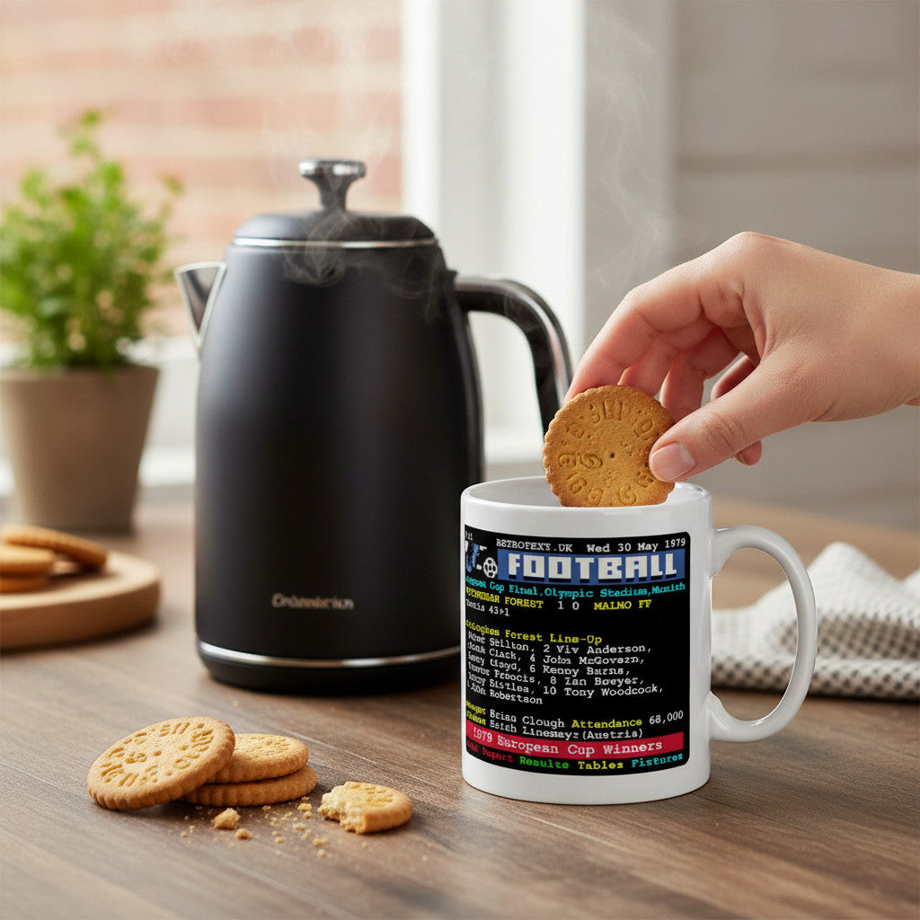 Retrotext Nottingham Forest 1979 European Cup Winners teletext design mug being used with a biscuit on a wooden table