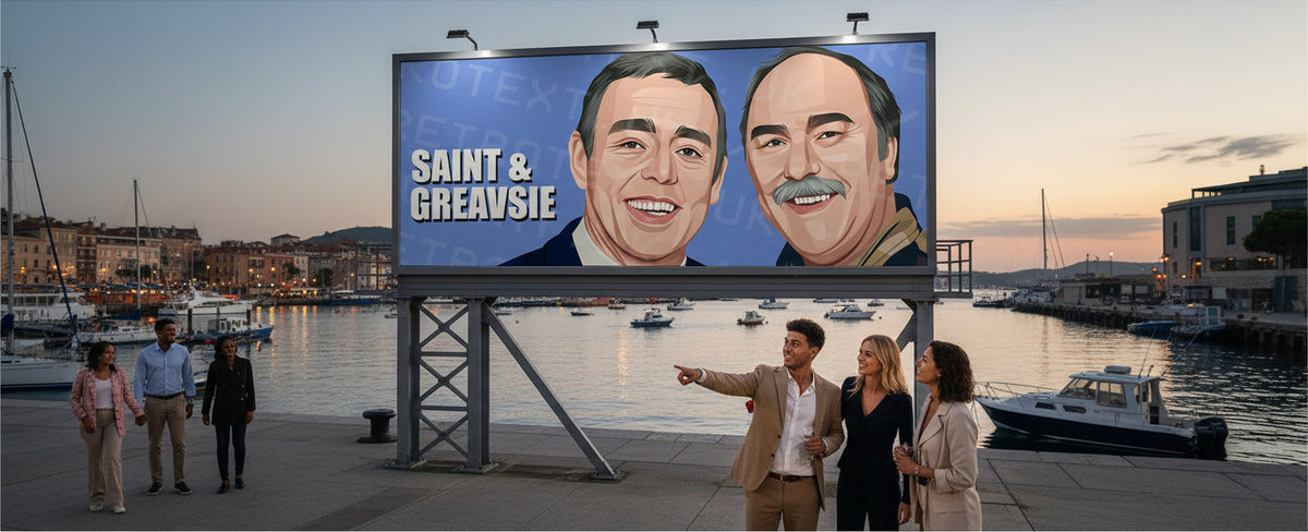 Retrotext Saint and Greavsie illustration on a large outdoor billboard overlooking a harbor at sunset