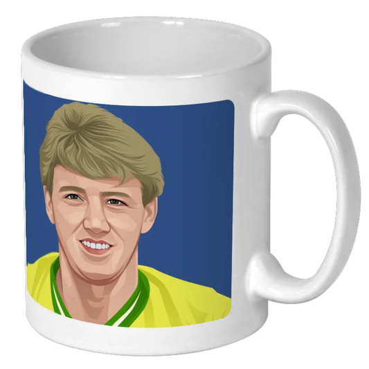 Retrotext ceramic mug featuring an illustration of Steve Bruce in a yellow Norwich City kit on a blue background